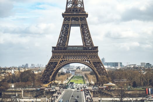 A picturesque view of the Eiffel Tower on a cloudy day in Paris, France, capturing the essence of this iconic landmark.