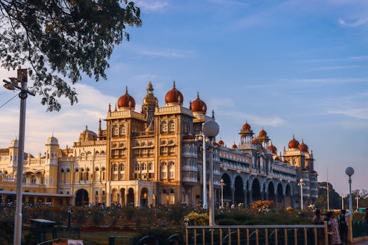 A breathtaking view of Mysore Palace, an iconic landmark in India, captured with architectural grandeur against a clear blue sky.