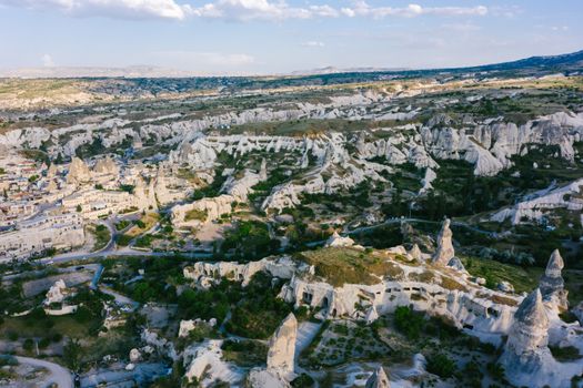 Explore the stunning and iconic rock formations in Cappadocia, Turkey, captured from above.